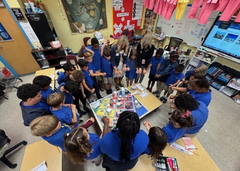 Six Mile Chartern - JA financial literacy teaching Kerry & Laura in circle